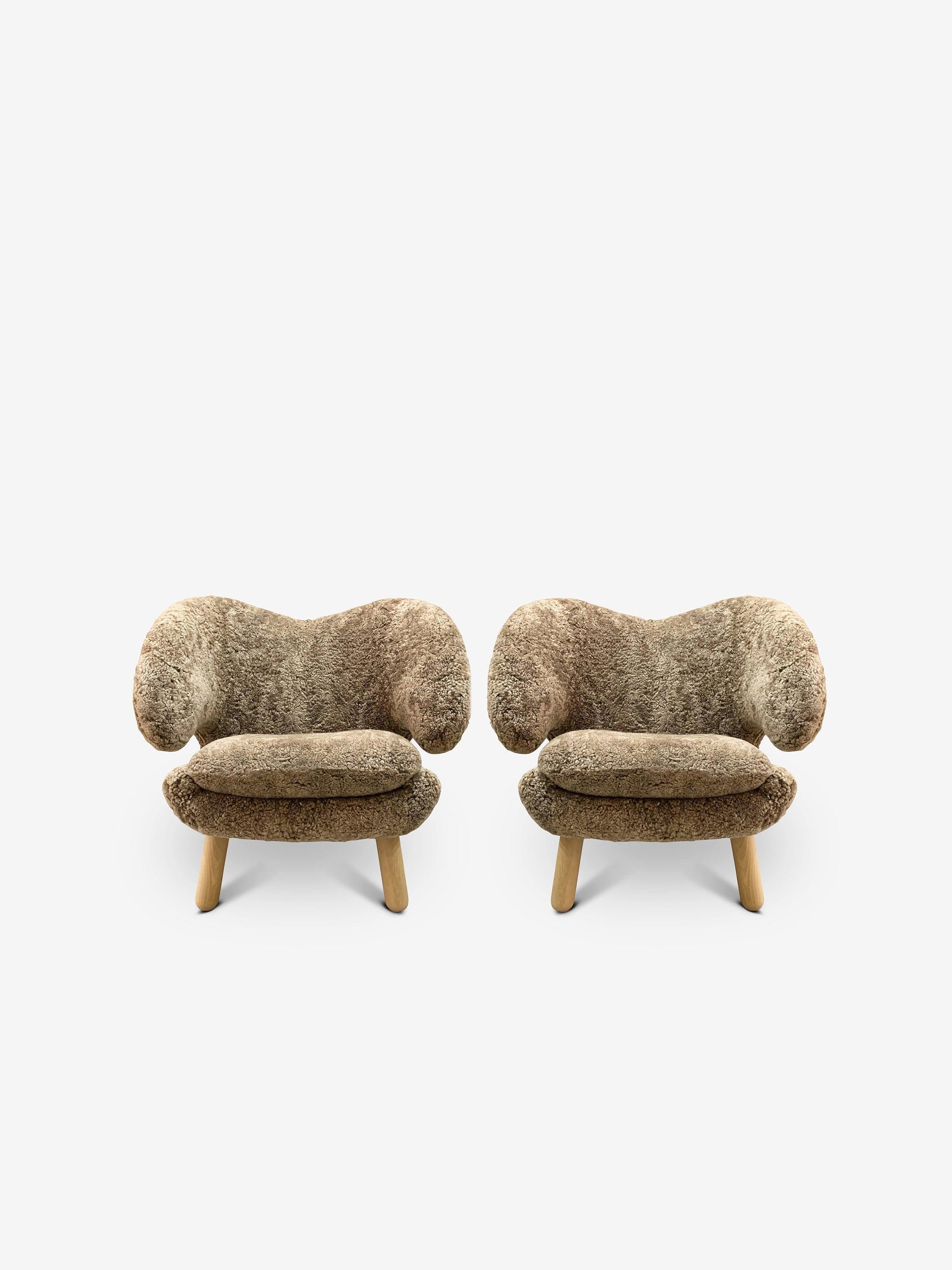 Pair Of Finn Juhl Pelican Chair in Sahara Sheepskin